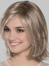 Super lightweight and ready to wear. She has long layers throughout and hit's perfect at the shoulders